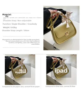 Macro detail of yellow PU leather crossbody bag with printed silk scarf handle and metal lock