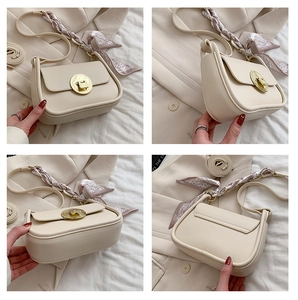 Detailed views of a cream saddle bag with golden lock and floral silk scarf decoration