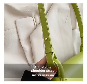 Close-up of adjustable avocado green leather strap with gold metal buckle details