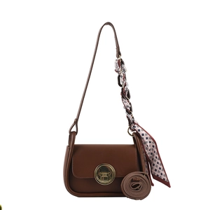 Brown faux leather shoulder bag with gold H-buckle and decorative printed silk scarf