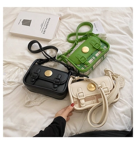 Detailed view of small vintage plaid crossbody bags in green, black, and cream colors