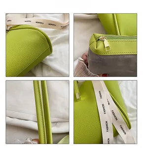 Vue détaillée du sac seau en cuir vert avec large bandoulière et fermeture éclair en métal