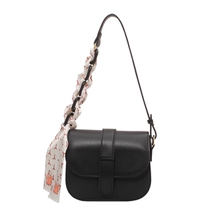Classic black leather saddle bag for women with decorative printed silk scarf strap