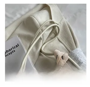 Close-up of beige tote bag fabric detail and fashion woven strap with handle