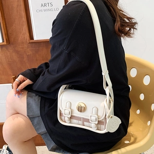 Fashionable beige mini crossbody bag with plaid pattern and gold metal buckle on flap