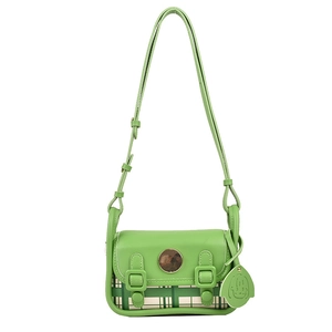 Mini green crossbody flap bag with adjustable straps and cute cartoon pendant