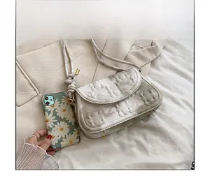 Mini marble textured crossbody bag in cream white with embossed pattern and gold hardware