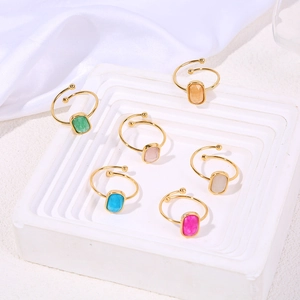 Set of six gold titanium steel rings with colorful rectangular natural stone inlays