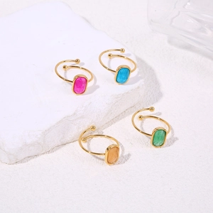 Adjustable gold titanium steel rings with colorful oval stones in four vibrant colors