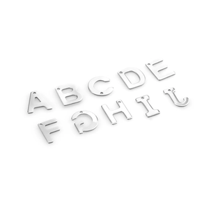 Macro view of stainless steel alphabet pendants A-J for DIY necklace and jewelry making