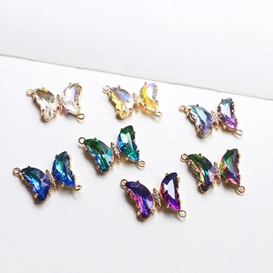 Macro view of butterfly charms with marquise crystals and double loops for jewelry making