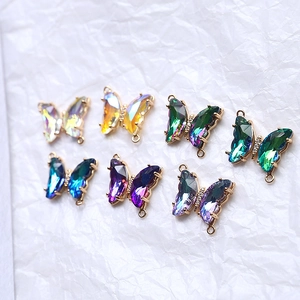 Detailed view of colorful butterfly crystal charms with gold-plated edges for DIY jewelry