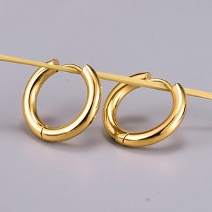 Minimalist gold hoop earrings in polished titanium steel for women with hinge closure