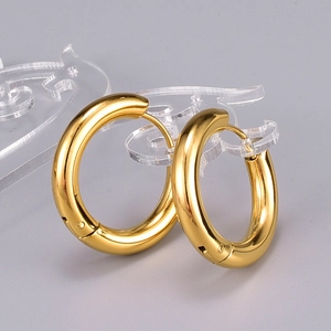 Polished gold plated titanium steel hoop earrings featuring a secure snap closure design