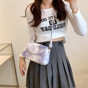 Chic purple marble pattern crossbody bag with wide knotted strap shown on model
