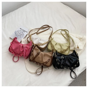Collection of ruched crescent underarm bags in five colors with chunky chain and leather straps