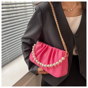 Pink pleated PU leather shoulder bag with gold chain and large pearl strap detail