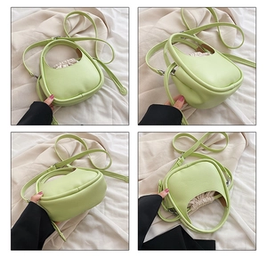 Détails d'un sac selle vert clair avec doublure à cordon et bandoulière réglable