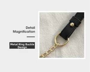 Detail magnification of black leather shoulder strap with gold metal buckle and chain