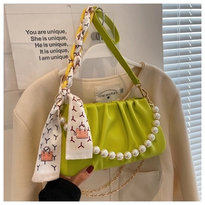 Avocado green pleated handbag with large pearl handle and silk scarf detail