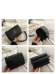 Detail of black quilted shoulder bag featuring gold deer logo and chain strap accents