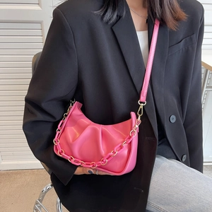 Hot pink pleated cloud bag with chunky acrylic chain and long strap for women