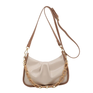 Minimalist beige ruched shoulder bag with chunky acrylic chain and adjustable strap