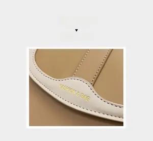 Detail of stitched leather saddle bag with gold foil Fashion & Bag lettering