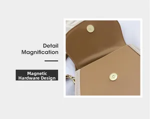 Detail magnification showing the golden magnetic snap closure on a brown leather bag