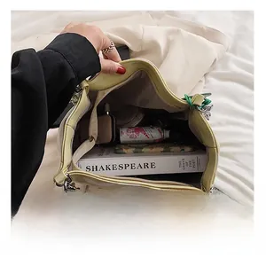 Detailed internal view showing large capacity and zipper closure of the yellow tote bag