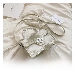 Detail showing white marble texture crossbody bag with flower clasp and braided handle