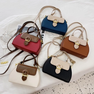 Minimalist leather crossbody bags in five elegant colorways with gold hardware and top handles