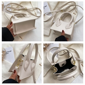 Détails du mini sac à main blanc crème avec boucles dorées et rangement intérieur