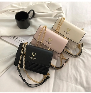 Three elegant quilted crossbody bags with gold deer logos shown in a lifestyle setting