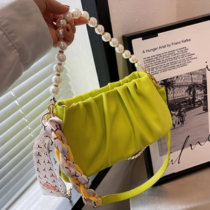 Lime green pleated cloud bag with pearl handle, chain strap and decorative silk scarf