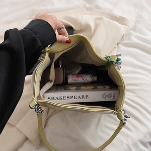 Large capacity cream leather tote bag with adjustable strap and silver chain detail
