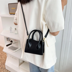 Petit sac bandoulière chic en cuir PU noir avec doubles poignées rondes pour femme