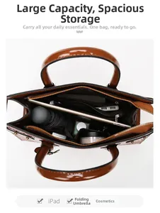 Spacious interior of brown crocodile embossed handbag showing iPad and daily essentials