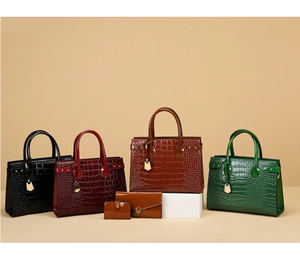 Detailed view of crocodile pattern leather handbag set with gold padlock and rivets