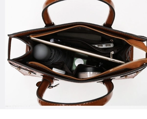 Top view of spacious brown crocodile texture tote interior with organized compartments