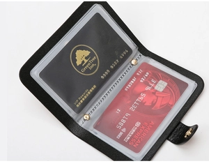 Macro view of black crocodile pattern wallet interior with multiple transparent card slots