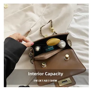 Internal view of brown quilted leather bag showing capacity for phone and cosmetics