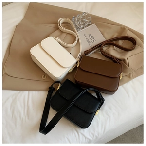 Minimalist faux leather square crossbody bags in cream, brown, and black with gold hardware