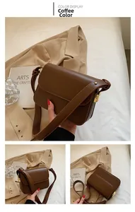 Detail view of coffee brown rectangular crossbody bag with elegant gold metal side lock