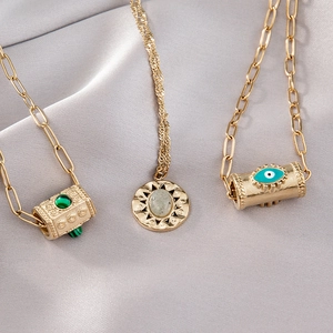 Colliers bohèmes en acier titane doré avec pendentifs œil turquoise et éclat d'étoile