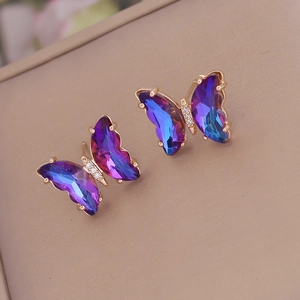 Luxurious butterfly stud earrings featuring purple-blue gradient crystals and gold finish