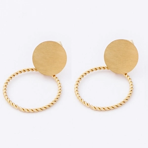 Detail of gold twisted hoop earrings with brushed metal disc and geometric rope texture