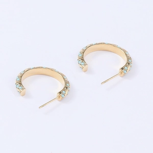 Golden stainless steel C-shaped twisted hoop earrings featuring blue turquoise inlay
