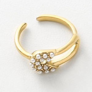 French style gold titanium steel open ring with clustered pearls on a white background