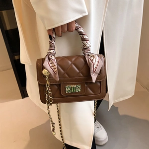 Brown quilted crossbody bag with silk scarf handle and gold chain strap for women